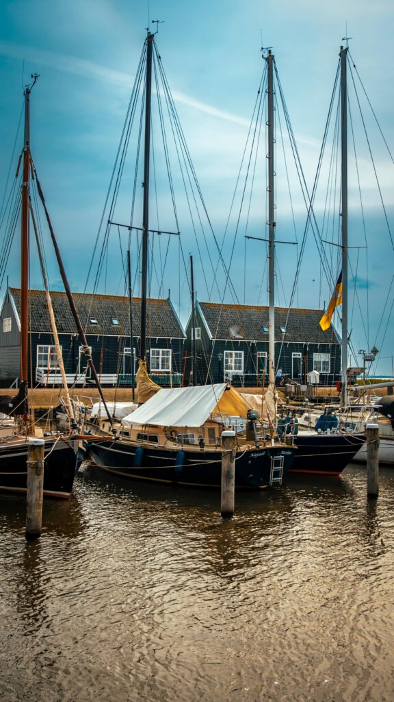 View of traditional wooden boats moored in the picturesque village of Marken, Netherlands.